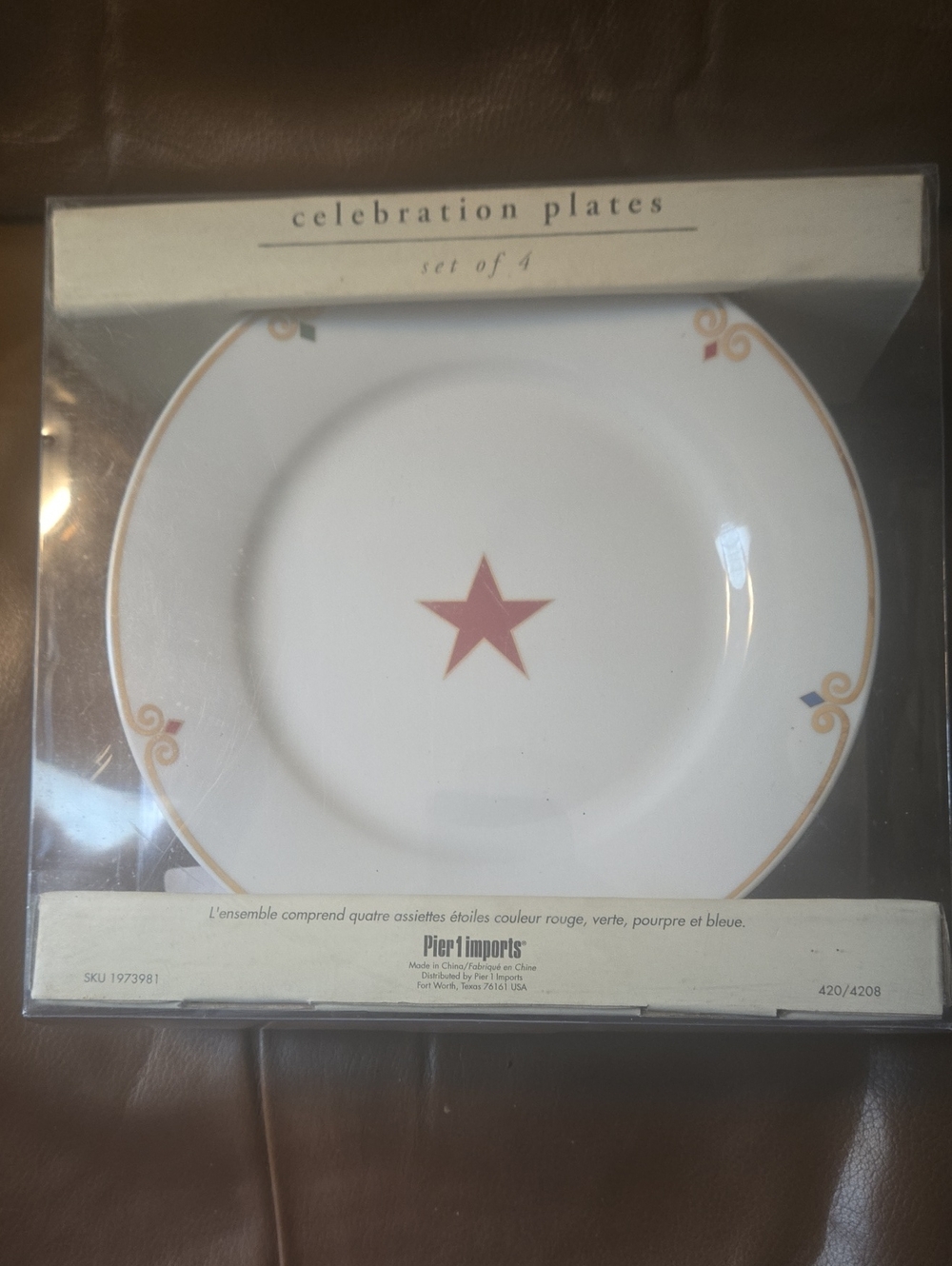 Pier 1 White Dinner Plate with Red Star and Gold Trim